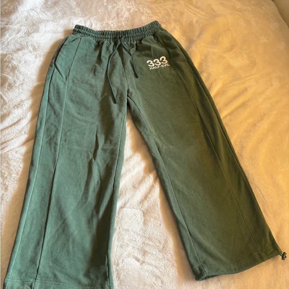 FOREST GREEN HALF EVIL PARACHUTE SWEATPANTS